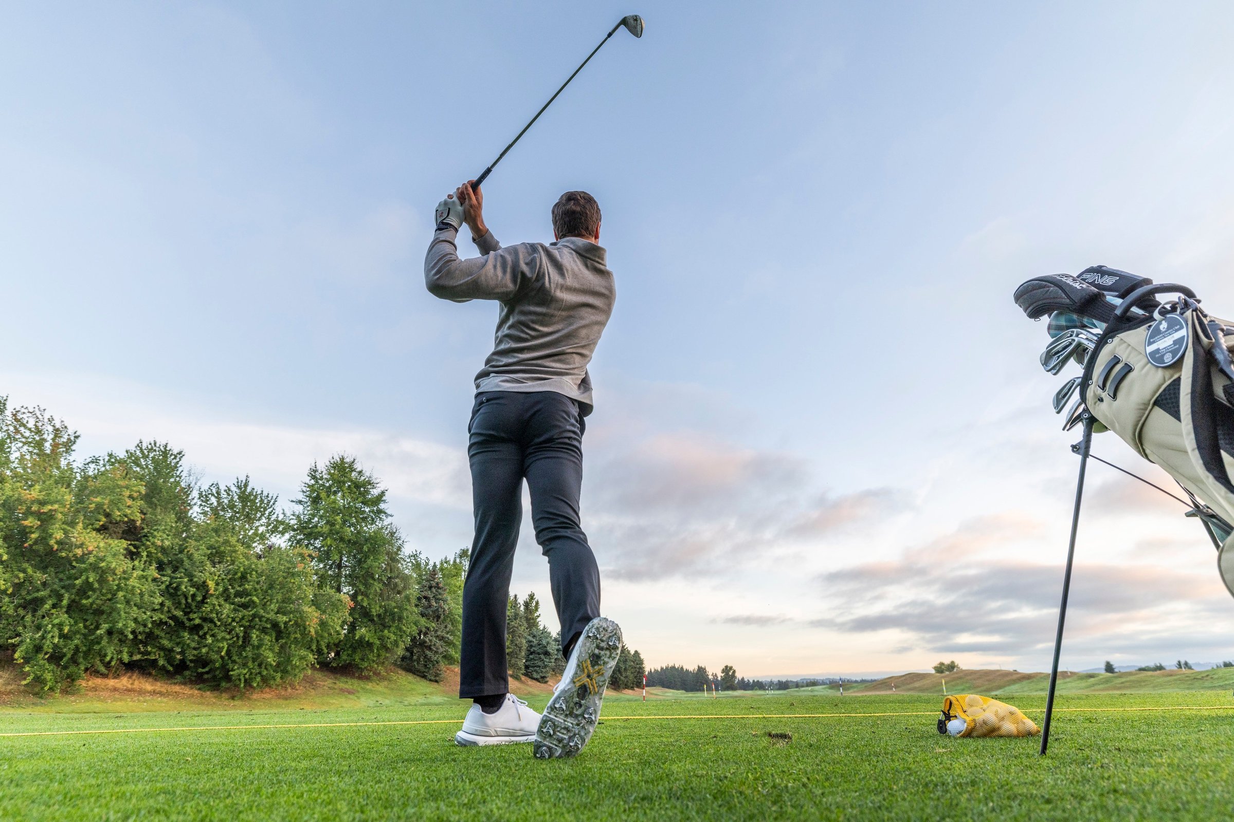 Golfer in follow-through at Langdon Farms with Payntr Eighty Seven SC outsole visible